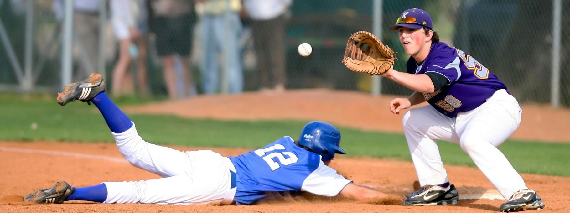 two man playing baseball during daytime