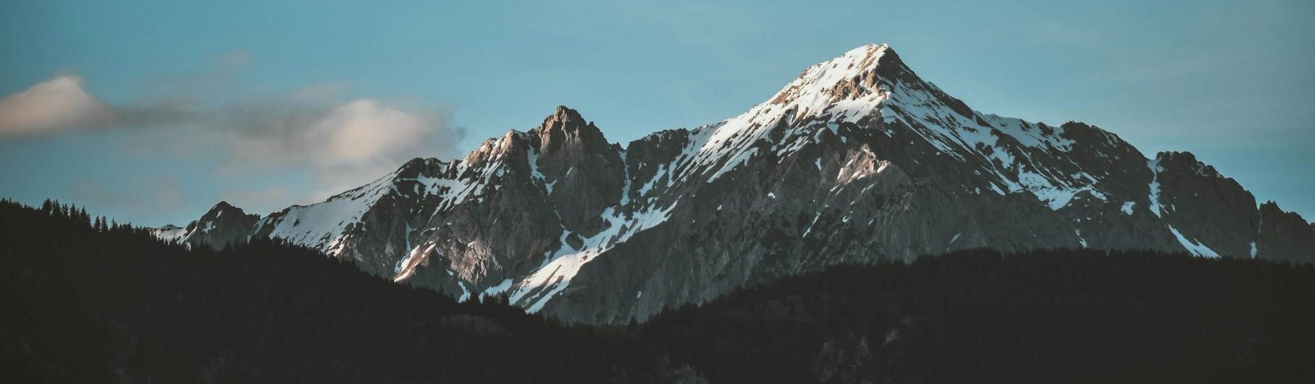 snow top mountain under clear sky